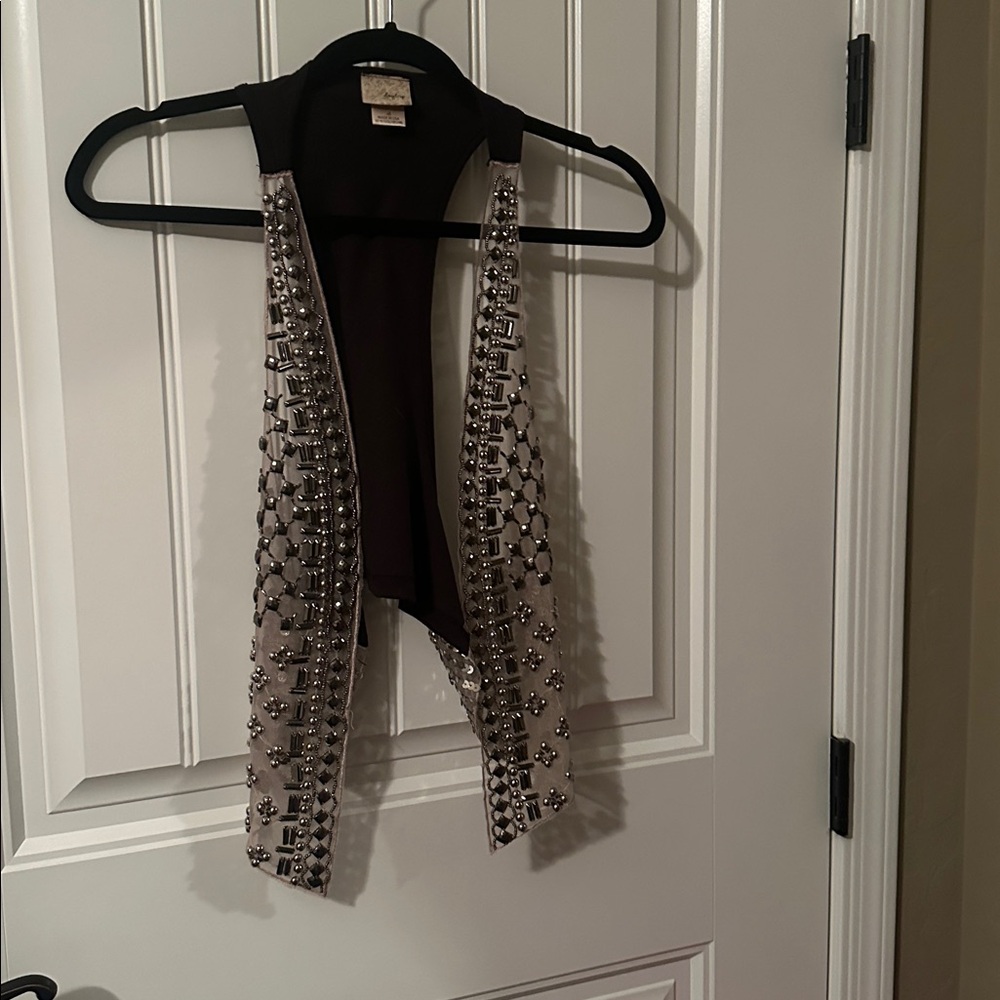 Silver and black vest